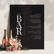 modern black and white bar signage with champagne and roses