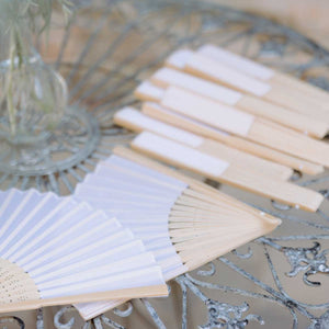 white wedding fan on table