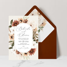 Bohemian Elegance wedding invitation in arch shape featuring cream and brown flowers with greenery set with terracotta coloured envelope and matching floral liner