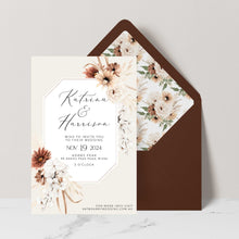 Bohemian Elegance wedding invitation featuring cream and brown flowers and white orchids with greenery set with brown coloured envelope and matching floral liner