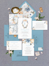 Bridgerton lake vintage inspired floral wreath and monogram wedding invitation suite with blue envelope and liner, flatlay