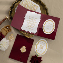 Embossed sculptured wedding invitation featuring roman column design closeup and shown with burgundy velvet pocket suite