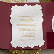 Embossed sculptured wedding invitation featuring roman column design and shown with burgundy velvet pocket