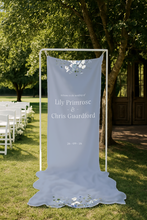 Primrose Spring floral fabric wedding sign with floral details in a garden setting