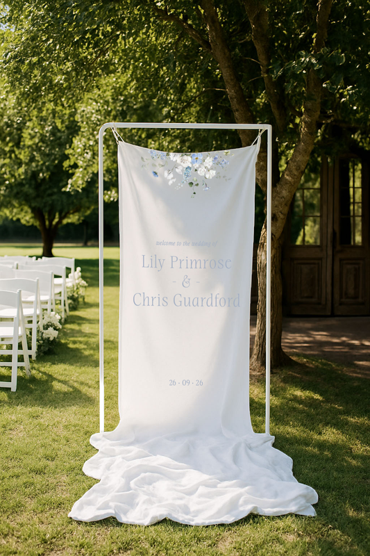 Primrose Spring floral fabric wedding sign with floral details in a garden setting
