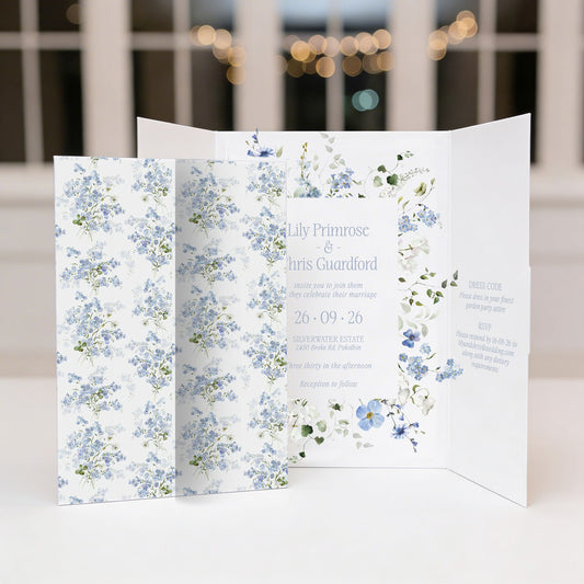 Floral wedding all in one gae fold invitation with blue and green flowers on a white background