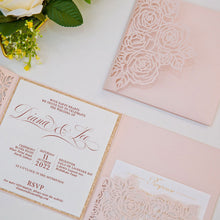 Elegant laser-cut wedding invitation with floral rose design shown with invitation and rose gold glitter backing card and detail card close up
