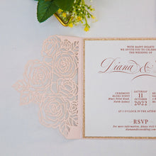 Elegant laser-cut wedding invitation with floral rose design open