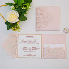 Elegant laser-cut wedding invitation with floral rose design shown with invitation and rose gold glitter backing card and detail card