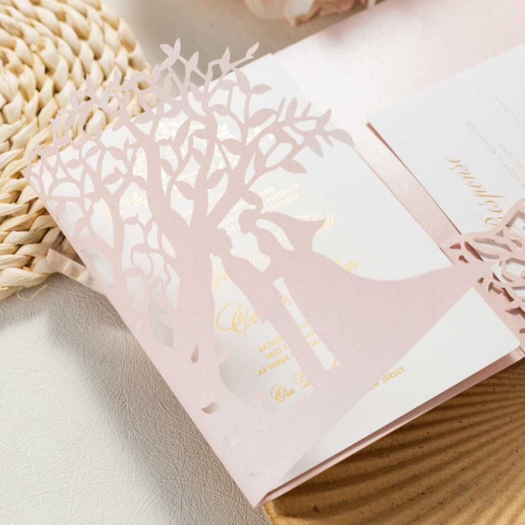 bride and groom under a tree laser-cut invitation