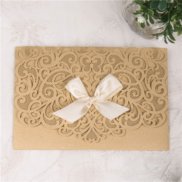 Graceful Heart - Laser-cut Tri-fold Pocket (closed) in gold shimmer, featuring a white bow