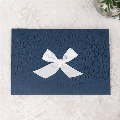 Graceful Heart - Laser-cut Tri-fold Pocket (closed) in navy shimmer, featuring a white bow
