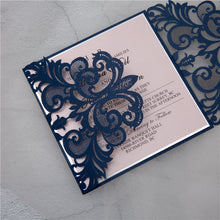 Laser-cut Gate Fold Wedding Invitation with swirl in navy with silver foil backing card detail