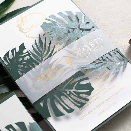 green monstera leaves laser-cut invitation