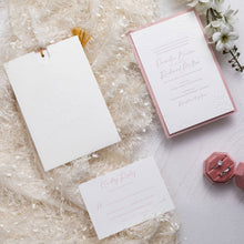 embossed pocket in white with personalised monogram vintage emblem on front shown with matching invitation in pink