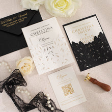 Elegant leaf laser-cut wedding invitations with sculptured embossing, and coordinated stationery, set with black lace design on a light surface with flowers and a sealing stamp.