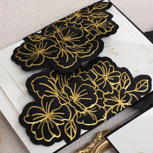 Black gate-Fold Invitation featuring floral design with gold foil closed