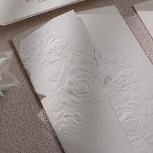 Sculptured embossed rose designed gate-fold wedding invitation, closed