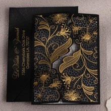 Black Laser-cut gate-fold invitation featuring anemone design with gold foil highlights closed