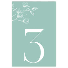 A vertical mint green table number card featuring a large white numeral '3' and delicate white magnolia floral line art in the upper left corner, Aleisha Collection.