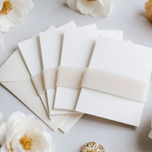 plain vellum belly on white card invitation stacked in group