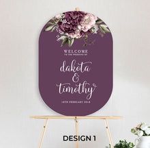 beautiful floral welcome sign Blushing Marsala Peonie featuring burgundy and dusty pink peonie florals in a double arch shape sitting on timber easel