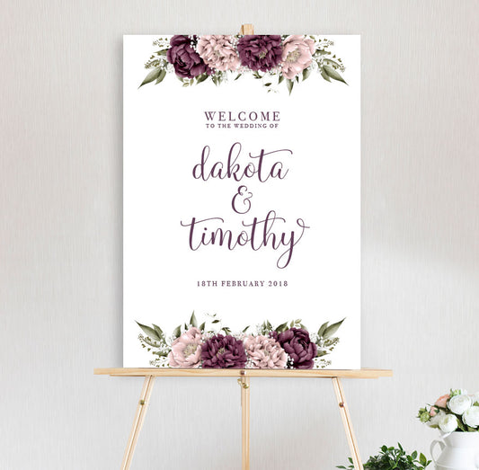 beautiful floral welcome sign Blushing Marsala Peonie featuring burgundy and dusty pink peonie florals sitting on timber easel