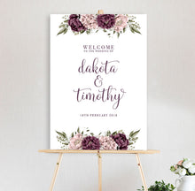 beautiful floral welcome sign Blushing Marsala Peonie featuring burgundy and dusty pink peonie florals sitting on timber easel