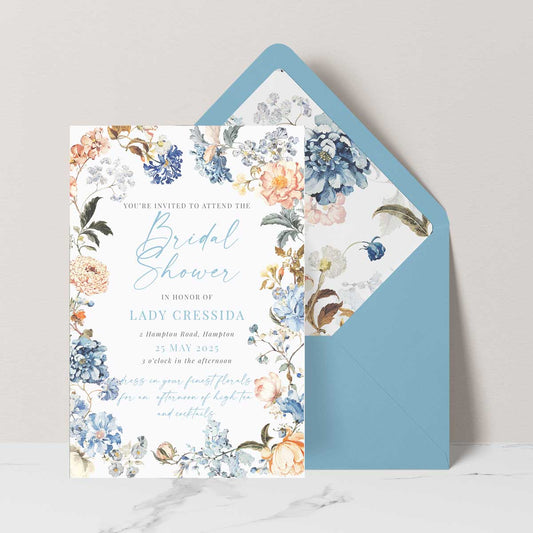 Bridgerton insppired bridal shower invitation with peach and blue florals in a frame blue envelope
