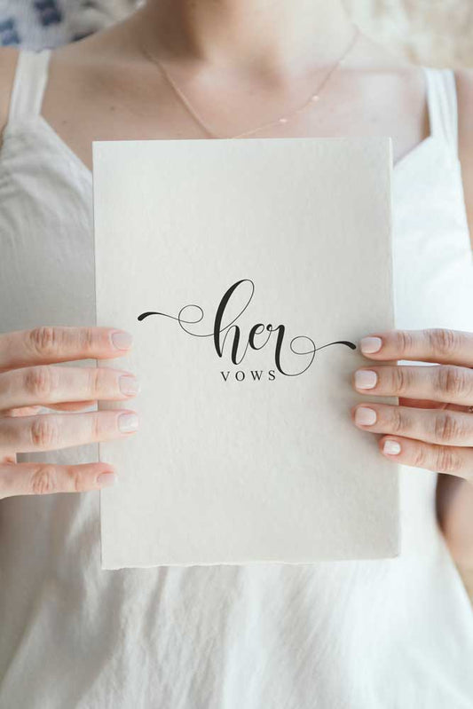 bride holding vow booklet