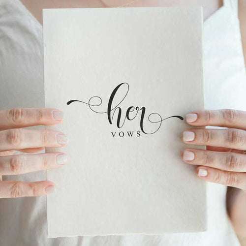 bride holding vow booklet