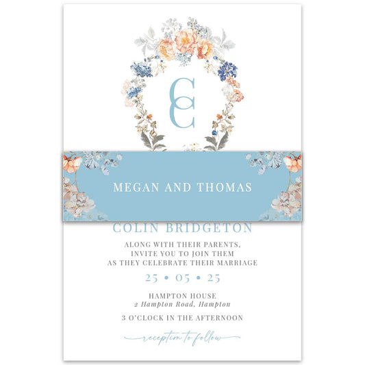 Bridgerton lake vintage floral inspired belly band featuring blue and peach florals with a blue background wrapped around wedding invitation