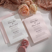 embossed wedding invitation with floral design on white and pink card with pink envelope, Newcastle Luxury Wedding Invitations