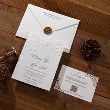 Wedding Invitation suite with floral sculptured embossing and wax seal on a white envelope, response card