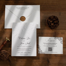 Wedding Invitation suite with floral sculptured embossing and wax seal on a white envelope, response card