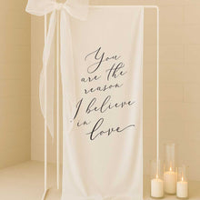 white linen fabric welding sign with saying you are the reason I believe in love
