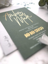 modern wedding invitation with gold foil on green card