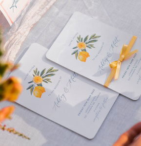 Lemon twist wedding invitation with yellow ribbon