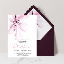bridal shower invitation featuring a pink magnolia flower in a modern watercolour design set with a burgundy envelope and matching envelope liner