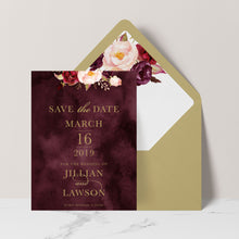 Marsala Flowers Save the Date card with peonie floral design and gold text on a burgundy background with gold envelope and matching floral liner