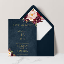 Marsala Flowers Save the Date card with peonie floral design and gold text on a navy background with navy envelope and matching floral liner