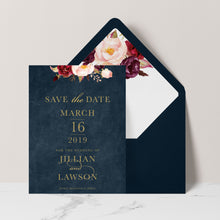 Marsala Flowers Save the Date card with peonie floral design and gold text on a navy background with navy envelope and matching floral liner