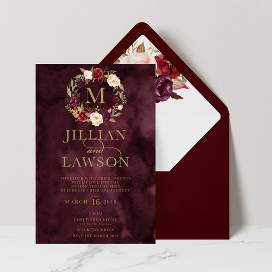 Marsala Flowers Engagement invitation with peonie floral wreath design and gold text on a burgundy background with burgundy envelope and matching floral liner