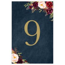 Marsala Flowers Table card featuring gold number, red, burgundy and pink peonie flowers on a navy background