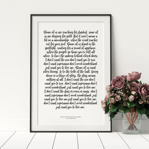1st year wedding anniversary vow prints in a handwritten script font in a black frame with florals in a vase