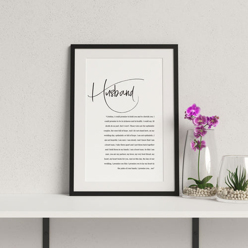 1st year wedding anniversary vow print for husband in a black frame with flowers in vase