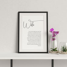 1st year wedding anniversary vow print for wife in a black frame with flowers in vase