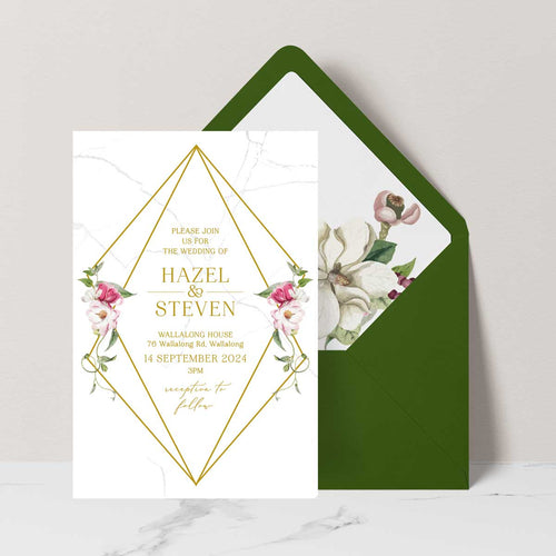 Beautiful watercolour floral designed wedding invitation with white and pink flowers in a geometric gold border green envelope