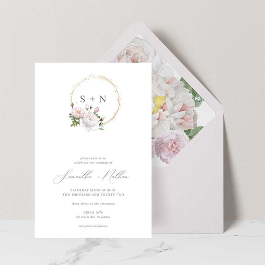 Watercolour floral wreath wedding invitation featuring pink and white roses peony pink envelope with liner