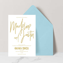 modern wedding invitation card with gold text on a white background, featuring a light blue envelope.